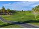Scenic golf course view with manicured greens, water hazards, and lush fairways at 2103 Poppywood Ave, Henderson, NV 89012