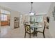 Open floor plan showcases the seamless flow between the kitchen, dining, and living area at 2103 Poppywood Ave, Henderson, NV 89012