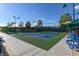Outdoor pickleball courts with shade structures and picnic tables, perfect for recreation at 2103 Poppywood Ave, Henderson, NV 89012