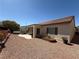Charming backyard featuring a covered patio and well-maintained desert landscaping with neutral tones at 2138 Fort Halifax St, Henderson, NV 89052