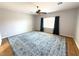 Large bedroom with wood floors, ceiling fan, and ample natural light showcases a cozy and inviting atmosphere at 2138 Fort Halifax St, Henderson, NV 89052