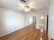 Neutral bedroom features hardwood floors, ceiling fan and access to closet and ensuite bathroom at 2138 Fort Halifax St, Henderson, NV 89052