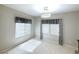 Bright dining area with tiled floor, recessed lighting, decorative chandelier, and large windows at 2138 Fort Halifax St, Henderson, NV 89052