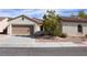 Charming single-story home with a well-maintained front yard and a two-car garage at 2138 Fort Halifax St, Henderson, NV 89052