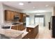 Spacious kitchen with matching countertops, stainless steel appliances, recessed lighting, and adjacent dining area at 2138 Fort Halifax St, Henderson, NV 89052