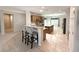 Open-concept kitchen featuring an island, breakfast bar, and stainless steel appliances at 2138 Fort Halifax St, Henderson, NV 89052