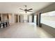 Bright and open living space with tile flooring, ceiling fan, and built-in cabinets at 2138 Fort Halifax St, Henderson, NV 89052