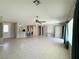 View of the spacious open-plan living room into the kitchen and tile floors at 2138 Fort Halifax St, Henderson, NV 89052