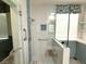 A modern bathroom shower with glass door, subway tile, and built-in seat offers both style and accessibility at 2138 Fort Halifax St, Henderson, NV 89052