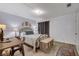 Comfortable bedroom with warm natural light, workspace, and stylish furnishings at 227 N Lamb Blvd # B, Las Vegas, NV 89110
