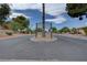 Community entrance featuring lush landscaping and well-maintained street at 227 N Lamb Blvd # B, Las Vegas, NV 89110