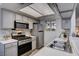 Well-lit kitchen featuring modern appliances, neutral cabinetry, and stainless steel sink at 227 N Lamb Blvd # B, Las Vegas, NV 89110