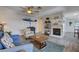 Open-concept living room boasting a fireplace, ceiling fan, and stylish decor at 227 N Lamb Blvd # B, Las Vegas, NV 89110