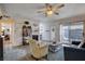 Inviting living room with a fireplace, a bookshelf, and patio access at 227 N Lamb Blvd # B, Las Vegas, NV 89110