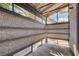 Enclosed patio with textured walls and ample sunlight, perfect for relaxation at 227 N Lamb Blvd # B, Las Vegas, NV 89110