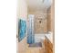 Bathroom with tiled shower, shower niche, tile floors, modern toilet, and towel rack at 2380 Sierra Sunrise St, Las Vegas, NV 89156