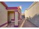 View of stucco exterior with terracotta tile roof, front door, and desert landscaping at 2380 Sierra Sunrise St, Las Vegas, NV 89156