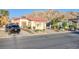 Single story home featuring desert landscaping and attached garage against a mountain backdrop at 2380 Sierra Sunrise St, Las Vegas, NV 89156
