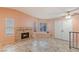 Inviting living room with a fireplace, ample lighting, and tile floors at 2380 Sierra Sunrise St, Las Vegas, NV 89156