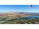 Breathtaking aerial view of the property showcasing the surrounding landscape with mountains and water at 244 Paraggi Bay Dr, Henderson, NV 89011
