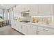 Modern kitchen with white cabinets, stainless steel appliances, and sleek countertops at 244 Paraggi Bay Dr, Henderson, NV 89011
