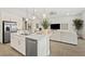 Bright kitchen and living area with stainless steel appliances and modern finishes at 244 Paraggi Bay Dr, Henderson, NV 89011