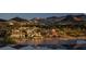 Beautiful waterfront homes reflecting on the water with mountain views in the background at 244 Paraggi Bay Dr, Henderson, NV 89011