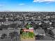 Aerial view of a beautiful home in a community surrounded by desert landscaping and trees at 2505 Showcase Dr, Las Vegas, NV 89134