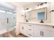 Stylish bathroom featuring dual sink vanity, modern fixtures, and a glass-enclosed shower at 2505 Showcase Dr, Las Vegas, NV 89134