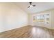 Light-filled bedroom with wood-look floors and a bay window offering picturesque views at 2505 Showcase Dr, Las Vegas, NV 89134