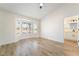 Sunlit bedroom with wood-look floors and ensuite bathroom for added privacy and comfort at 2505 Showcase Dr, Las Vegas, NV 89134