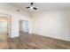 Bedroom with wood-look floors, ceiling fan, and walk-in closet for ample storage at 2505 Showcase Dr, Las Vegas, NV 89134