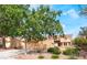 Charming single-story home featuring a well-manicured front yard and a two-car garage at 2505 Showcase Dr, Las Vegas, NV 89134