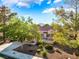Beautiful single-story home with desert landscaping, mature trees, and a spacious driveway at 2505 Showcase Dr, Las Vegas, NV 89134