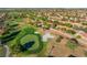 Stunning aerial view of the golf course, highlighting the lush greens and manicured fairways surrounded by beautiful residential homes at 2505 Showcase Dr, Las Vegas, NV 89134