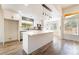 Modern kitchen with white cabinets, stainless steel appliances, and a large island at 2505 Showcase Dr, Las Vegas, NV 89134