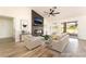 Staged living room with modern furniture, a fireplace, and access to the outdoors at 2505 Showcase Dr, Las Vegas, NV 89134