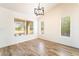 Bright, sunny room with wood floors and several windows at 2505 Showcase Dr, Las Vegas, NV 89134