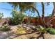 Large private back yard with mature trees and comfortable seating at 2600 E Owens Ave, North Las Vegas, NV 89030
