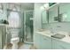 Bathroom with a walk-in shower, large mirror, and pastel color scheme at 2600 E Owens Ave, North Las Vegas, NV 89030