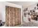 Bedroom with closet behind a curtain and wall decor at 2600 E Owens Ave, North Las Vegas, NV 89030