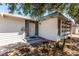 Charming single-story home featuring a unique exterior design with xeriscape landscape and a inviting front door at 2600 E Owens Ave, North Las Vegas, NV 89030