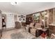 Cozy living room with wood paneling, comfortable seating, and a display cabinet near the front door at 2600 E Owens Ave, North Las Vegas, NV 89030