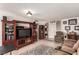 Inviting living room features a built-in entertainment center, comfortable seating, and decor at 2600 E Owens Ave, North Las Vegas, NV 89030