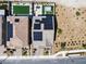 Aerial view of a home with solar panels, showcasing the backyard with a pool, spa, and well-maintained landscaping at 2601 Gallarate Dr, Henderson, NV 89044