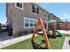Low maintenance backyard featuring a playground set and artificial turf at 2601 Gallarate Dr, Henderson, NV 89044