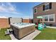 Enjoy the backyard hot tub and play area in this outdoor living space at 2601 Gallarate Dr, Henderson, NV 89044
