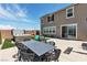Well-maintained backyard with a hot tub, play structure, and patio dining set at 2601 Gallarate Dr, Henderson, NV 89044