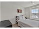 Comfortable bedroom with a black bed frame, city views, and stylish wall art at 2601 Gallarate Dr, Henderson, NV 89044