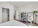 Bright bedroom with modern decor, large mirror, and stylish storage solutions at 2601 Gallarate Dr, Henderson, NV 89044